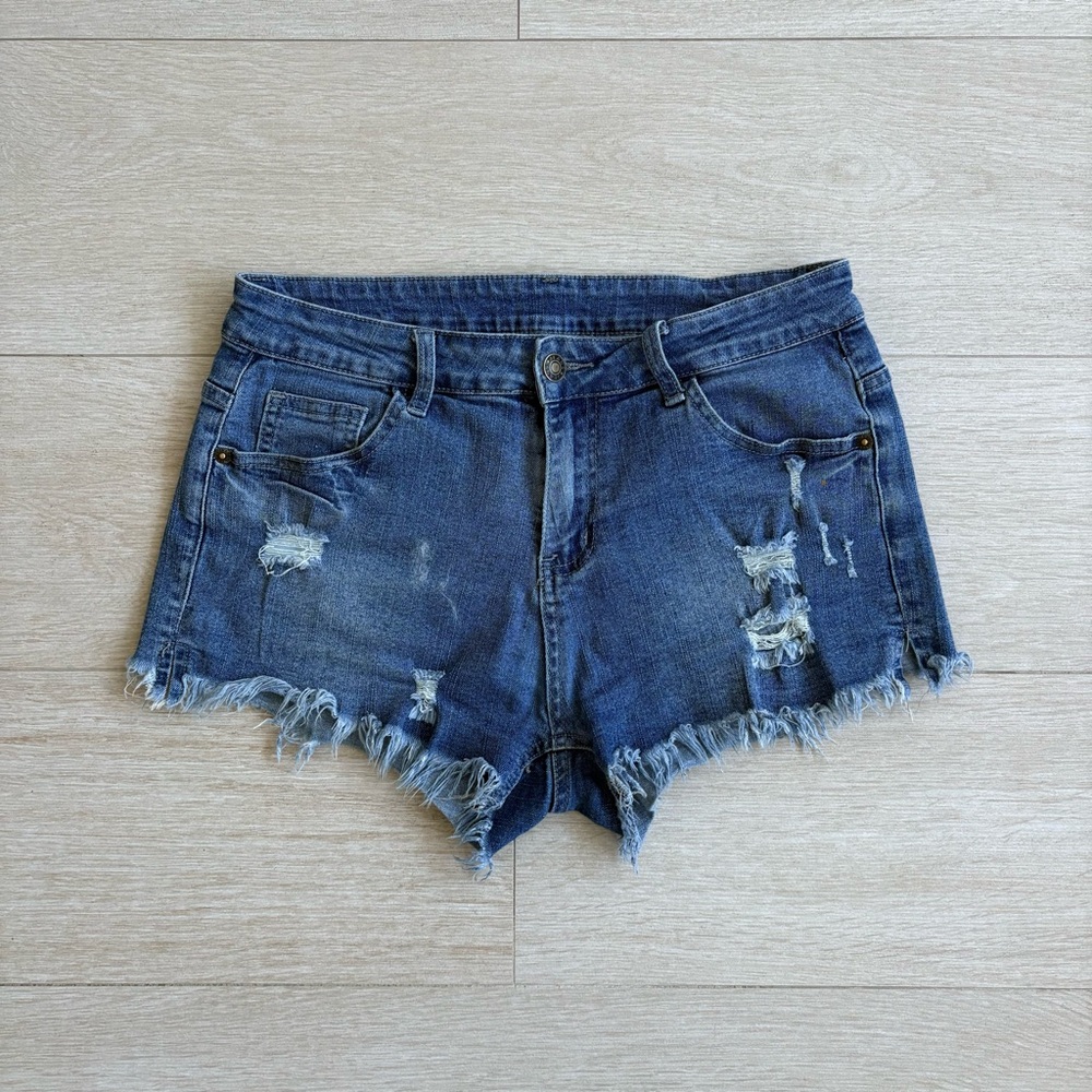 Vintage distressed blue denim shorts. Size 4. Perfect Condition. Bought from a b